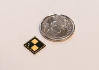 Smart Battery Chip Placed beside a Singapore 10 Cent Coin