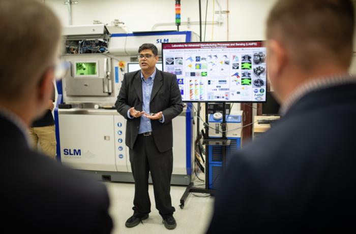 Prahalada Rao, associate professor of industrial and systems engineering, speaks in the Future Manufacturing Lab in Kelly Hall.