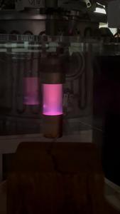 'Cosmic dust' analogue under electronic bombardment