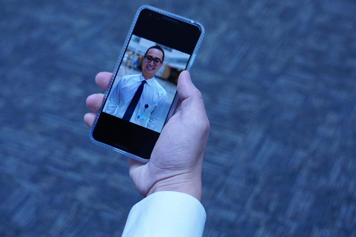 UC Davis telehealth Scholar Keisuke Nagawa, M.D., with IPhone