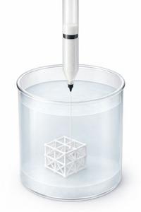 An image or diagram showing the nozzle extruding ink into the gel. This illustrates the "in-gel" technique which is a key part of the innovation, showing how the structure floats suspended as it is built.