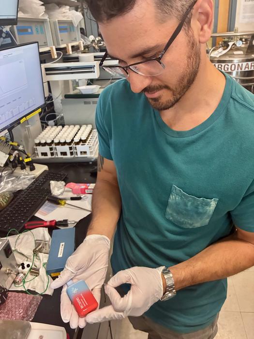 Mark Salazar in lab with vape pod-vert
