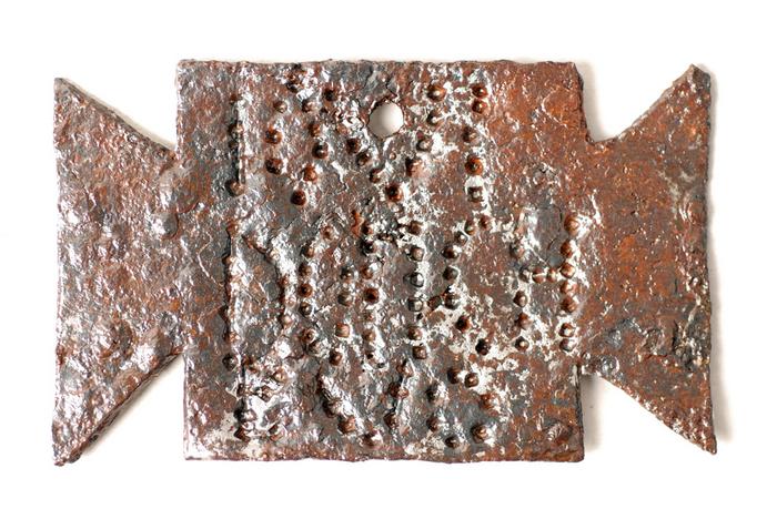 Small iron plaque, shaped like a tabula ansata
