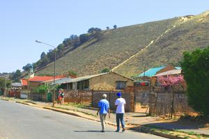 Mine dump situated directly behind community homes, Witwatersrand Basin region.