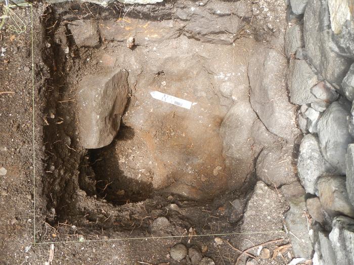 Excavation of a pit that contained large amounts of animal bone, shellfish remains, glass bottles, and cooking pot fragments.