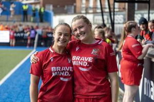 Ffion James and Cleo Pallister-Turley celebrate Varsity win