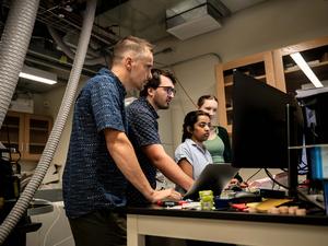 researchers running analysis on computer