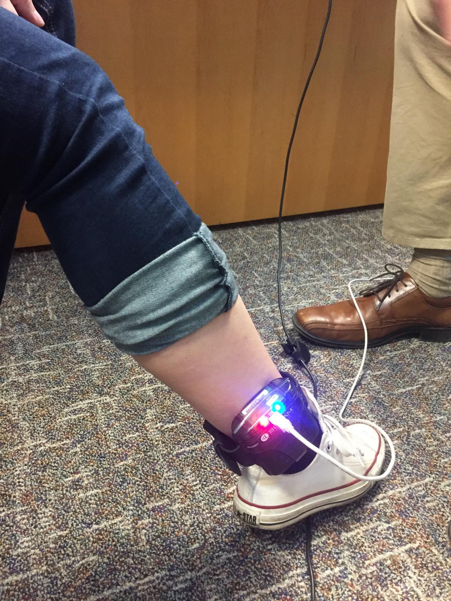Student Being Fitted with a Trans-Dermal Blood Alcohol Monitor - 2