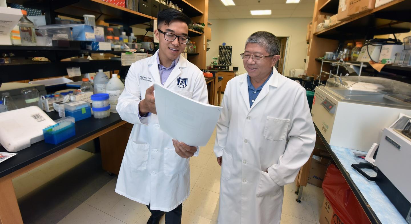 Paul Tran and Dr. Jin-Xiong She