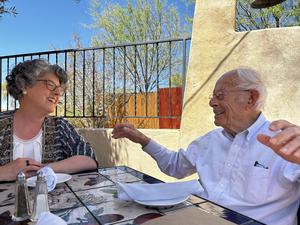 Drs. Seymor Reichlin and Esther Sternberg sharing a laugh over a birthday dinner—April 2024.