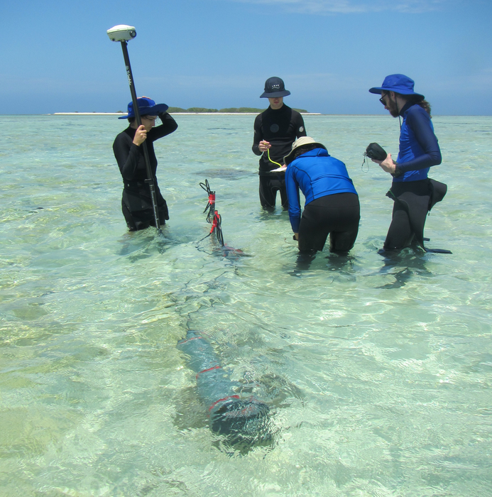 Geoscientists collecting bathymetric data
