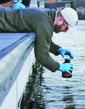 Student Collects Water Sample