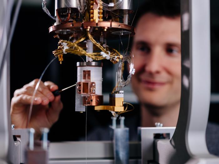 Professor Tim Bartley, head of the ‘Mesoscopic Quantum Optics’ research group, demonstrates working with the cryostat.