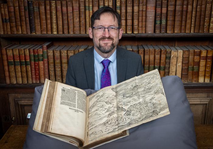Professor Nathan MacDonald with the Bible map_1