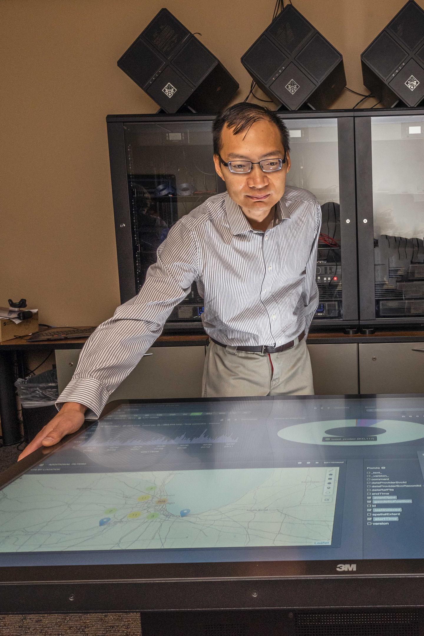 Tian Ma working with remote sensing systems.