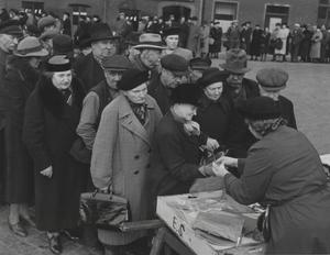 People queuing to buy fresh Baltic herring in Stockholm during World War II