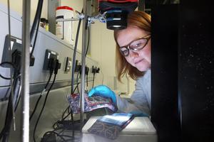 Dr Jennifer Edwards checking light properties of SunPad