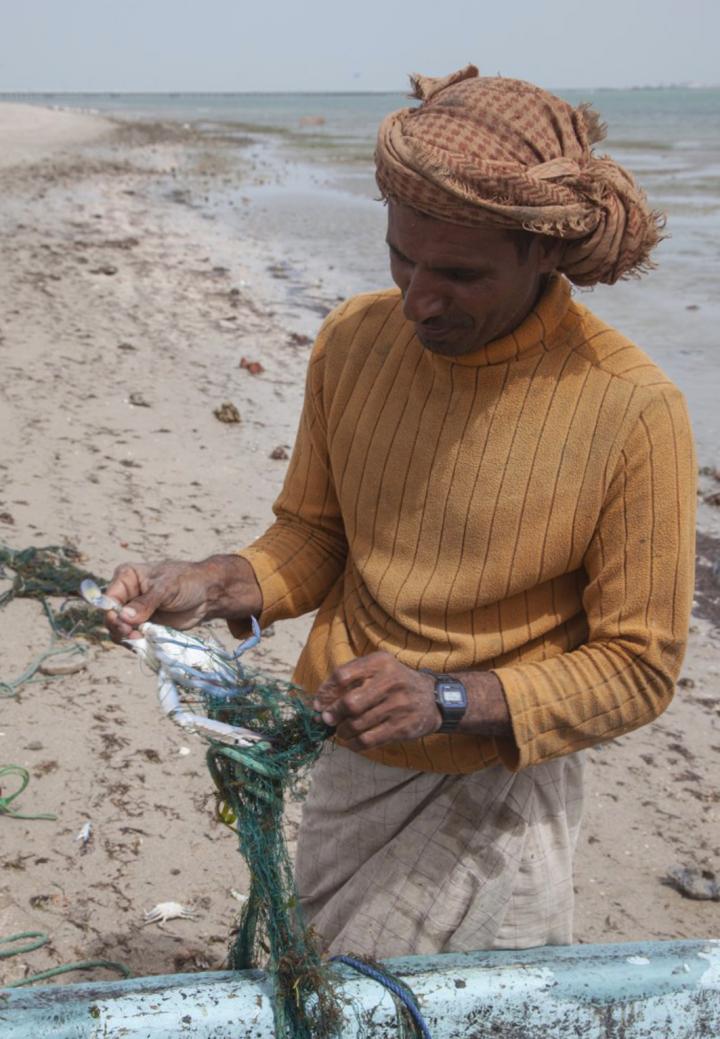Fisherman with Blue Swimming Crab Portunus segnis