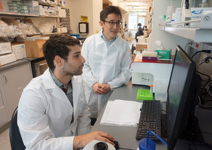 Ali Zamat and Gabe Kwong in the lab