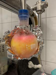 The photo shows a flask containing fluorescently labeled glutathione.