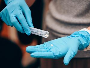 A test tube contains the CitraBoneQMg bone implants
