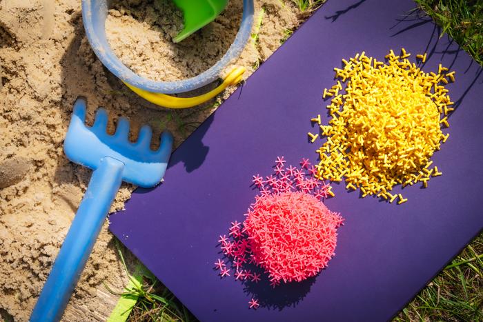 3-D printed hexapod (pink) and dolosse (yellow) sand