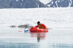 Bernard Laval retrieving a mooring in a Milne Ice Shelf pond.