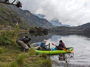 Students return from collecting a core sample in a lake in Uganda's Rwenzori Mountains.