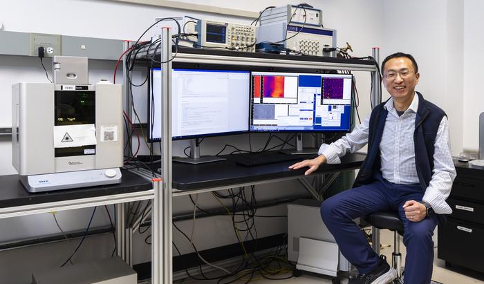 ORNL's Yongtao Liu with lab equipment