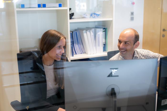 ISTA researchers discussing data in the lab