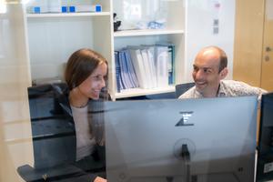 ISTA researchers discussing data in the lab
