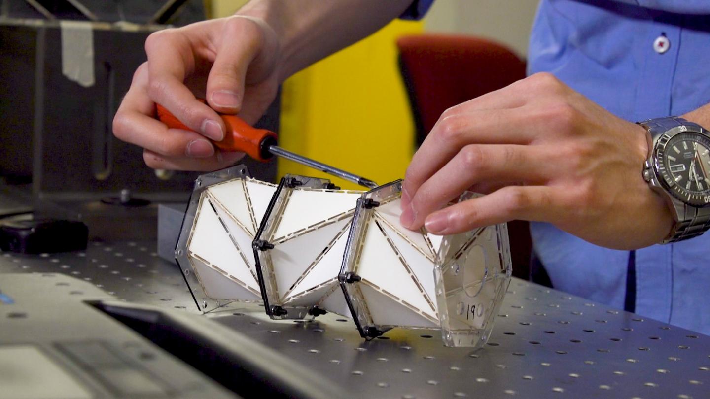 Origami-Based Impact Mitigation via Rarefaction Solitary Wave Creation (1 of 6)
