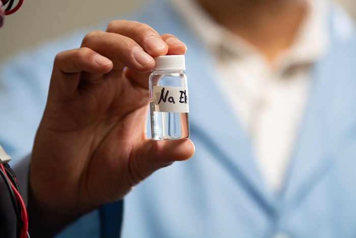 Man holding vial