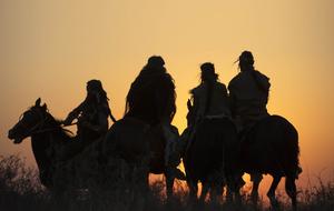Riders against sunset