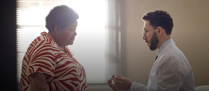 A doctor speaking with a patient