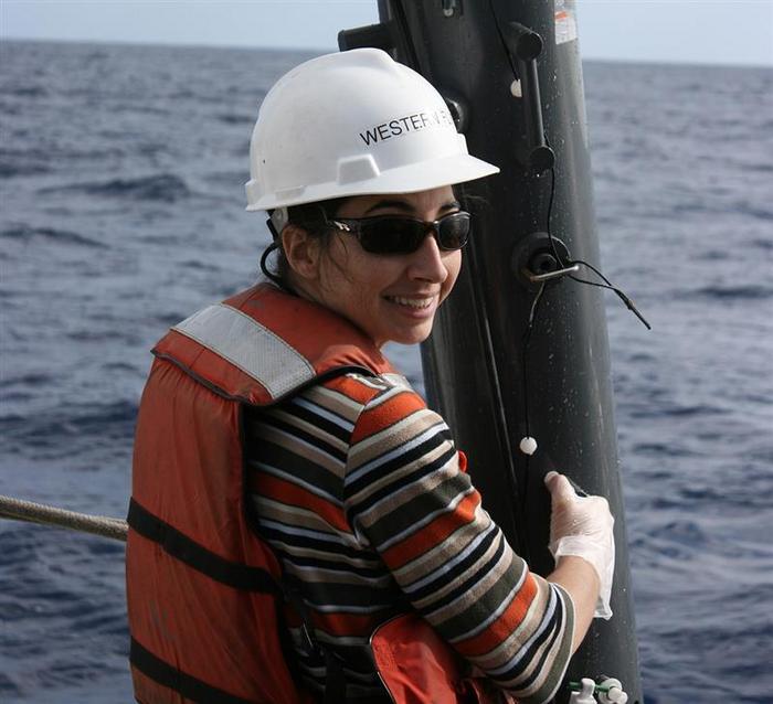 Alexandra Z. Worden working in the North Pacific Ocean during experiments examining growth rates of phytoplankton in the wild.