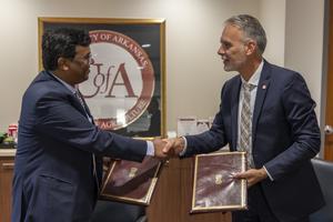 Priya Ranjan and Jean-François Meullenet shake hands
