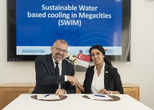 CEO of Grundfos Foundation Mr Kim Nøhr Skibsted, affirming ties with NTU Singapore Professor Madhavi Srinivasan