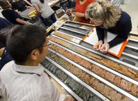Scientists Examine the Working and Archive Halves of a Freshly Split Core