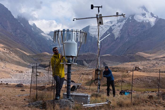 ISTA researchers working on a precipitation monitoring station