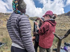 Collecting a sediment core from a glacial lake in Uganda