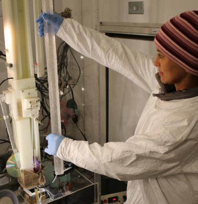 Researcher loads 18,000-year-old Antarctic ice for continuous analysis.