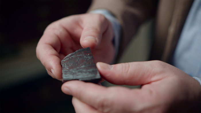 Dr Papineau holding rock sample