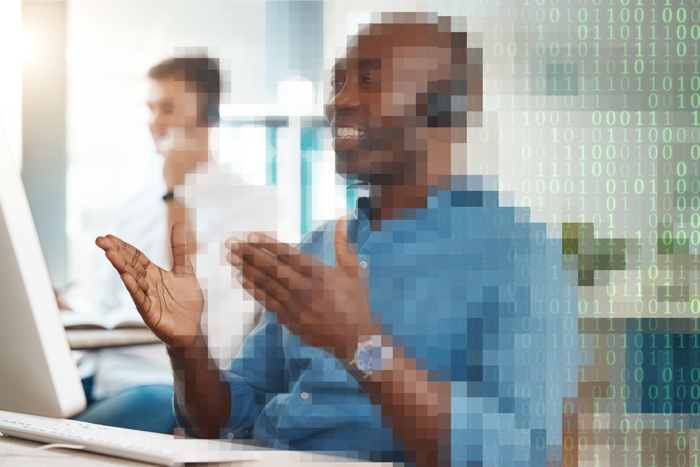 Graphic of a pixelated employee in front of a computer.