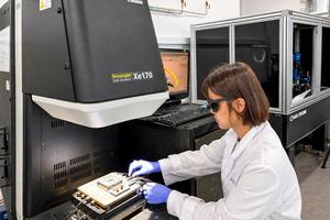 A research team member conducts performance tests on the developed technology