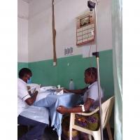 Woman in Malawi receiving iron supplements