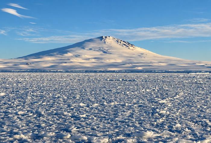 Sea ice off Victoria Land, Antarctica, with Mount Melbourne in the background.