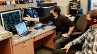 Researchers reviewing structure