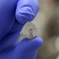 Titanium piece coated with artificial bone