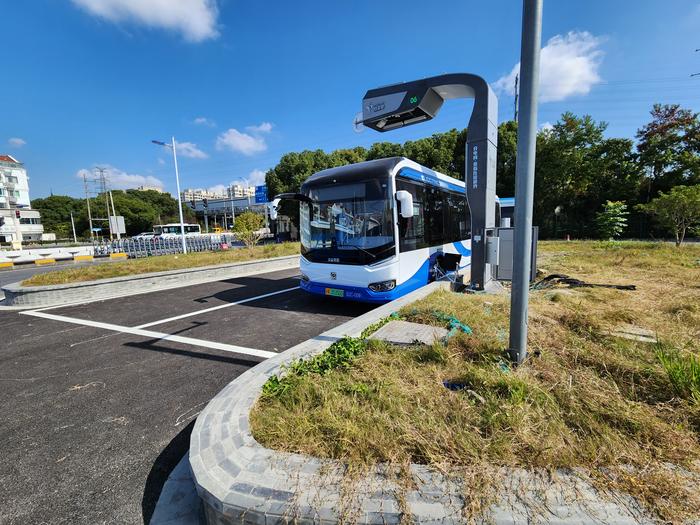 The autonomous on-demand shuttle bus at a charging stop.